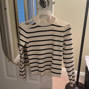 White seater with black striped with shoulder cuts